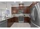 Modern kitchen featuring granite countertops, stainless steel appliances, and ample cabinet space at 14493 Promenade Pkwy, Odessa, FL 33556