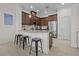 Stylish kitchen with granite countertops, stainless steel appliances, and a breakfast bar with seating at 14493 Promenade Pkwy, Odessa, FL 33556