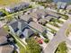 An elevated view of a neighborhood with a mix of modern homes, spacious yards, and well-planned streets at 14493 Promenade Pkwy, Odessa, FL 33556