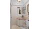 Elegant bathroom featuring a granite countertop and decorative mirror at 15053 Peace Blvd, Spring Hill, FL 34610