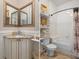Dual view of bathroom with vanity and tub/shower combination at 15053 Peace Blvd, Spring Hill, FL 34610