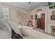 Well-lit bedroom featuring large, comfortable bed and dresser at 15053 Peace Blvd, Spring Hill, FL 34610