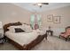 Bedroom with carved wood bed frame and soft, neutral tones at 15053 Peace Blvd, Spring Hill, FL 34610