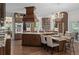 Gourmet kitchen with custom cabinetry, an island with seating, and modern appliances at 15053 Peace Blvd, Spring Hill, FL 34610