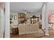 Open living room with a brick fireplace, display case, and comfortable seating arrangement at 15053 Peace Blvd, Spring Hill, FL 34610