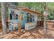 Charming outdoor bar featuring swing seating, perfect for enjoying drinks and conversation in a relaxed setting at 15053 Peace Blvd, Spring Hill, FL 34610