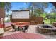 Outdoor entertainment area featuring a movie screen, stage, fire pit, and seating for gatherings at 15053 Peace Blvd, Spring Hill, FL 34610