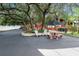 Inviting outdoor seating area with mature trees, perfect for relaxing or entertaining guests at 15053 Peace Blvd, Spring Hill, FL 34610
