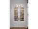 Pantry with white double doors and fully stocked shelves at 15053 Peace Blvd, Spring Hill, FL 34610