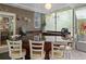 Inviting screened patio with granite countertop bar, seating, overhead lighting, and view of the outdoor scenery at 15053 Peace Blvd, Spring Hill, FL 34610