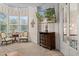 Cozy sitting room with a large bay window, comfortable seating, and television at 15053 Peace Blvd, Spring Hill, FL 34610