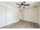 Bright bedroom featuring a modern ceiling fan, closet, and light-colored walls and floors at 1540 7Th E Ave, Bradenton, FL 34208