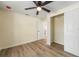 A bedroom featuring wood floors, a ceiling fan, and a closet at 1540 7Th E Ave, Bradenton, FL 34208