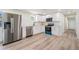 Modern kitchen featuring stainless steel appliances, sleek white cabinetry, and a functional layout at 1540 7Th E Ave, Bradenton, FL 34208