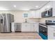 Bright, updated kitchen with stainless steel appliances, modern cabinetry, and lots of workspace at 1540 7Th E Ave, Bradenton, FL 34208