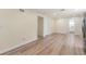 Spacious living area featuring wood-look vinyl floors, neutral paint colors, and modern recessed lighting at 1540 7Th E Ave, Bradenton, FL 34208