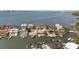 Aerial view of waterfront homes with private docks and stunning bay views at 19 N Pine Cir, Belleair, FL 33756