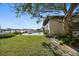 Home exterior view shows a pool and waterfront access at 19 N Pine Cir, Belleair, FL 33756