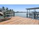 Enjoy the waterfront from this private dock, complete with comfortable seating and open views of the peaceful harbor at 19 N Pine Cir, Belleair, FL 33756