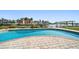 Backyard pool with brick border overlooking the water and waterfront property at 19 N Pine Cir, Belleair, FL 33756