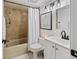 Well-lit bathroom with a shower/tub combo, modern vanity, and updated fixtures at 2413 Bayshore Blvd # 801, Tampa, FL 33629