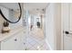 Bright hallway with tile floors, a decorative mirror, and neutral paint at 2413 Bayshore Blvd # 801, Tampa, FL 33629
