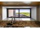 Modern kitchen sink and granite countertops framed with view of mature trees and city skyline at 2413 Bayshore Blvd # 801, Tampa, FL 33629