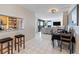 Open floor plan with pass through to kitchen, dining area, and comfortable seating at 2413 Bayshore Blvd # 801, Tampa, FL 33629