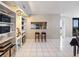 Open floor plan with shelving, pass through to kitchen, and balcony access at 2413 Bayshore Blvd # 801, Tampa, FL 33629