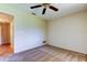Bedroom with carpet, ceiling fan, and adjoining bathroom at 2557 Laurelwood Dr # 10E, Clearwater, FL 33763