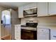 Modern kitchen featuring stainless steel appliances, sleek countertops, and ample cabinet space at 2557 Laurelwood Dr # 10E, Clearwater, FL 33763