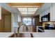 Bright kitchen boasts stainless steel appliances, white cabinets, and a view from the kitchen sink at 2557 Laurelwood Dr # 10E, Clearwater, FL 33763