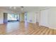 Light-filled living room with wood floors and sliding doors to the outdoors at 2557 Laurelwood Dr # 10E, Clearwater, FL 33763