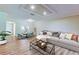 Bright living room features wood floors, recessed lighting, and neutral paint palette at 2557 Laurelwood Dr # 10E, Clearwater, FL 33763