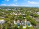 A high angle view of the property and surrounding neighborhood filled with lush trees and waterways nearby at 322 Ontario Ave, Crystal Beach, FL 34681
