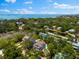 A beautiful high angle view of the property showing lush greenery and the bay in the distance at 322 Ontario Ave, Crystal Beach, FL 34681