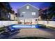 Home exterior with a pool, spa, lounge chairs, and lush tropical foliage at 322 Ontario Ave, Crystal Beach, FL 34681