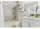 Bright bathroom features modern vanity with white cabinets and decorative elements at 322 Ontario Ave, Crystal Beach, FL 34681