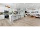 Open-concept kitchen with island seating and a view of the adjacent living area at 322 Ontario Ave, Crystal Beach, FL 34681