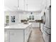 Modern kitchen with stainless steel appliances and a large island with seating at 322 Ontario Ave, Crystal Beach, FL 34681