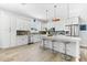 Bright, modern kitchen with stainless steel appliances, a large island, and plenty of cabinet space at 322 Ontario Ave, Crystal Beach, FL 34681