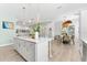 Open kitchen and dining area with island, offering seamless flow and modern design at 322 Ontario Ave, Crystal Beach, FL 34681