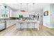 Well-appointed kitchen featuring a large island with seating and modern fixtures at 322 Ontario Ave, Crystal Beach, FL 34681
