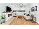 Cozy living room with a fireplace, comfortable seating, and stylish decor at 322 Ontario Ave, Crystal Beach, FL 34681