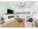 Bright living room featuring a fireplace, comfortable seating, and stylish decor at 322 Ontario Ave, Crystal Beach, FL 34681