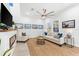 Elegant living room with a modern fireplace, comfortable seating, and stylish decor at 322 Ontario Ave, Crystal Beach, FL 34681