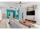 Stylish living room with comfortable seating, a ceiling fan, and colorful accents at 322 Ontario Ave, Crystal Beach, FL 34681
