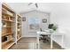 Bright, well-organized office with built-in shelves and a modern glass desk at 322 Ontario Ave, Crystal Beach, FL 34681