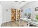 Bright, well-organized office with built-in shelves and a modern glass desk at 322 Ontario Ave, Crystal Beach, FL 34681