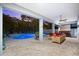 Outdoor living area with a stylish patio, a pool, a hot tub and comfortable seating at 322 Ontario Ave, Crystal Beach, FL 34681